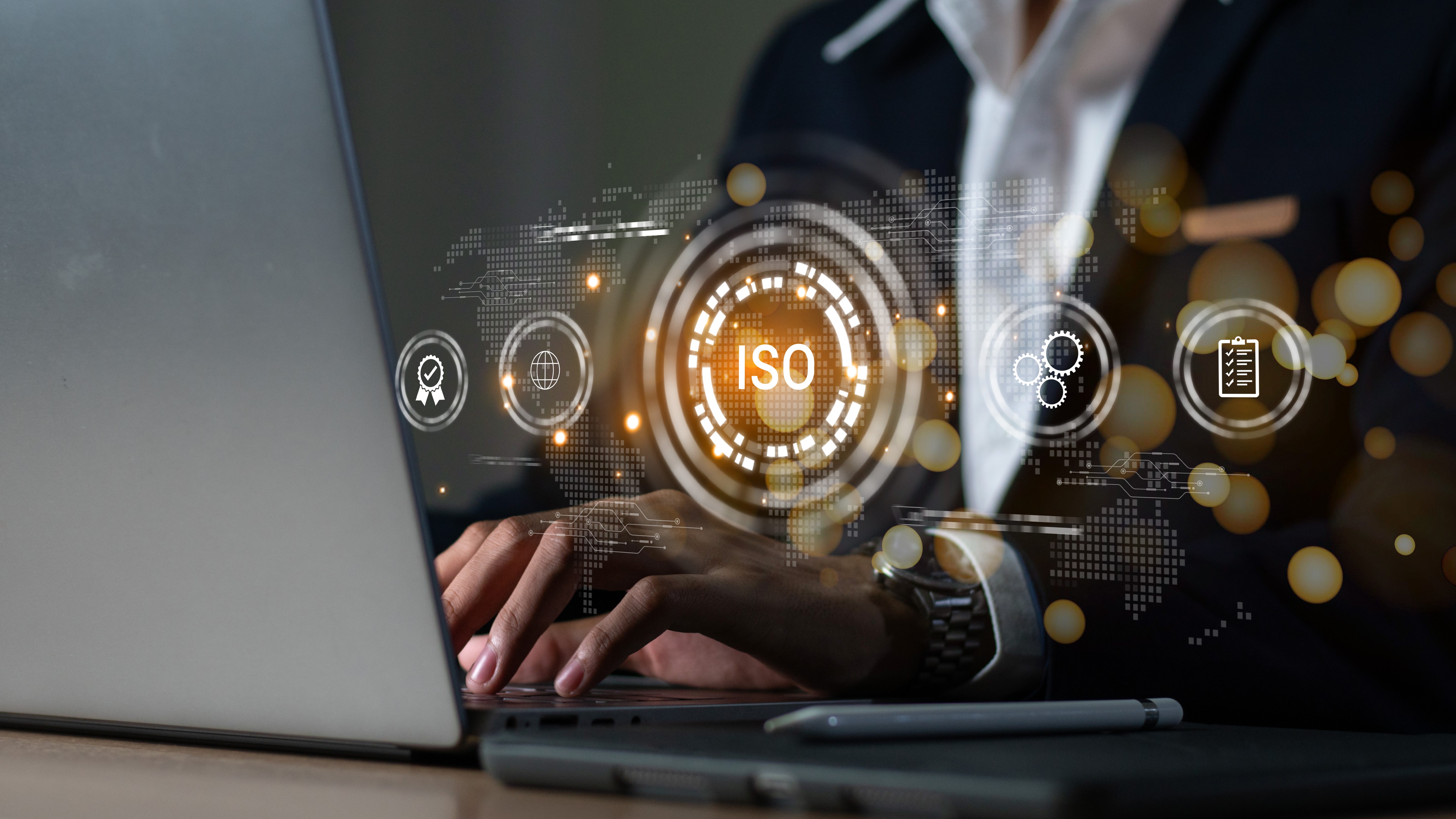 Auditor working on laptop with symbolic overlays signaliding third-party audit context