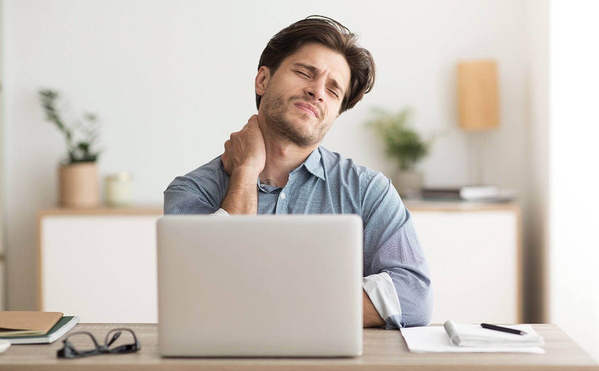 woman sitting beside desk