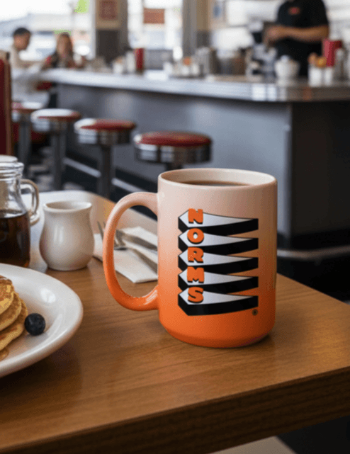 Norm’s Restaurants ceramic coffee mug in a diner