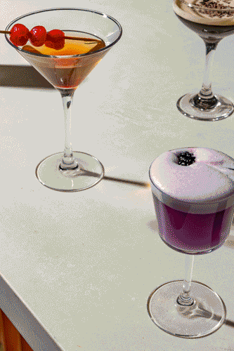 Young black woman witting at the table working on a laptop