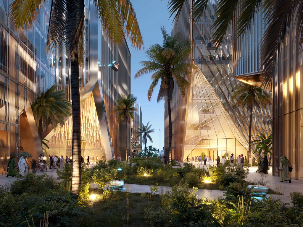 Hotel lobby in District 11 with guests seated at tables, creating a lively and welcoming atmosphere.