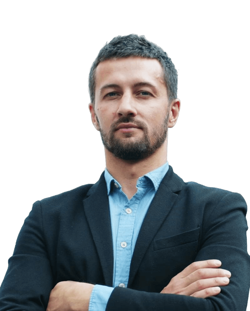 man wearing green crew-neck top and eyeglasses with black frames looking at side