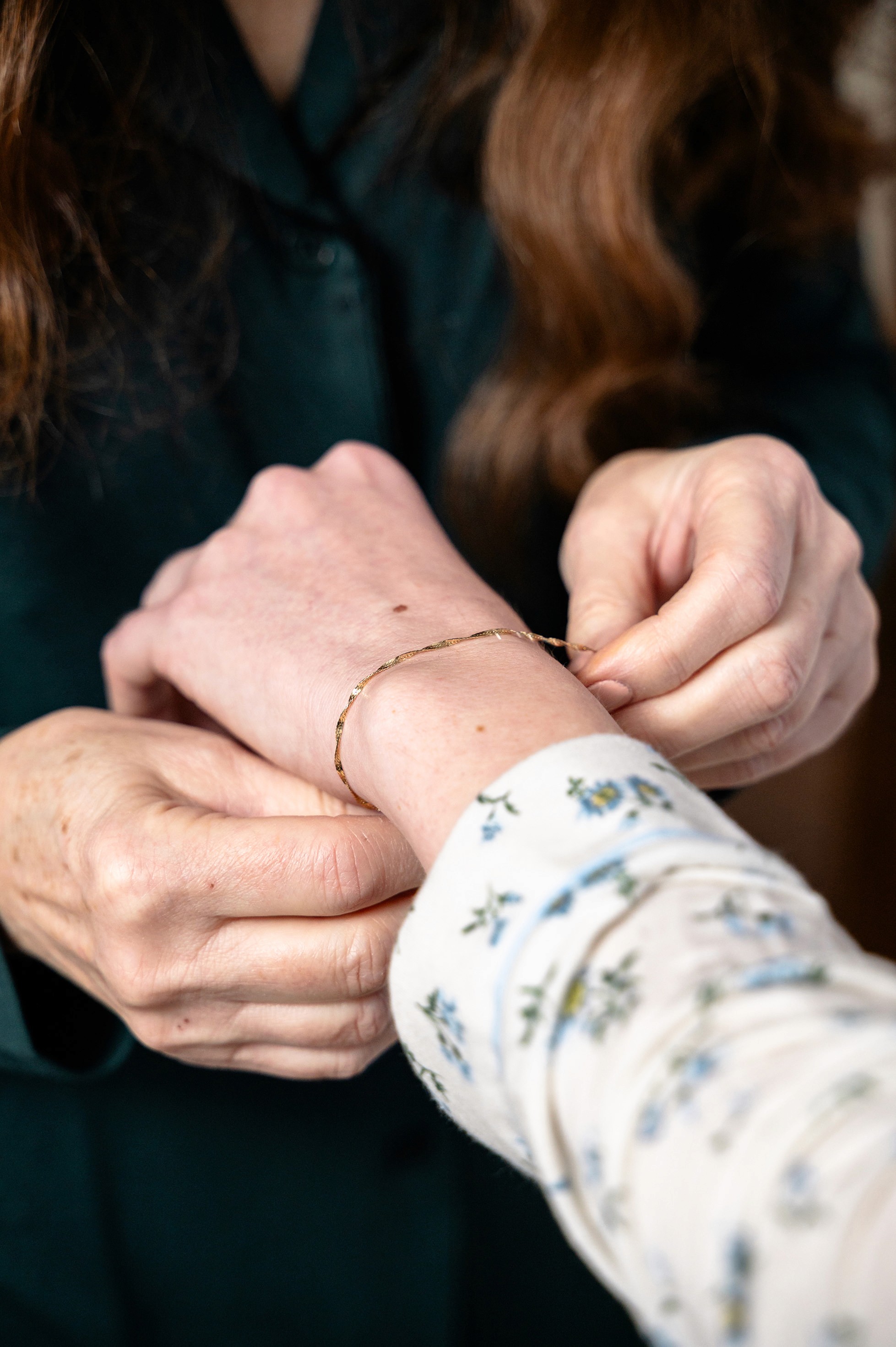 Flat lay wedding details with bouquet, rings, and sparkling bridal heels