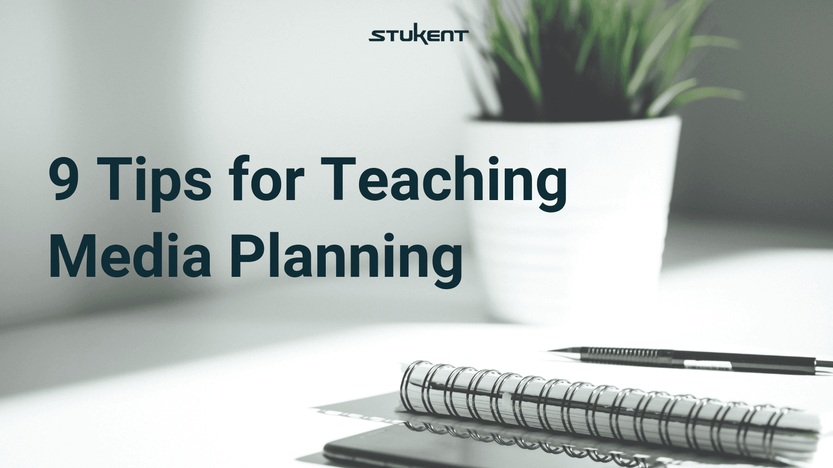 Professional pen sitting atop a notebook and laptop with a plant in the background. Text says "9 Tips for Teaching Media Planning". 