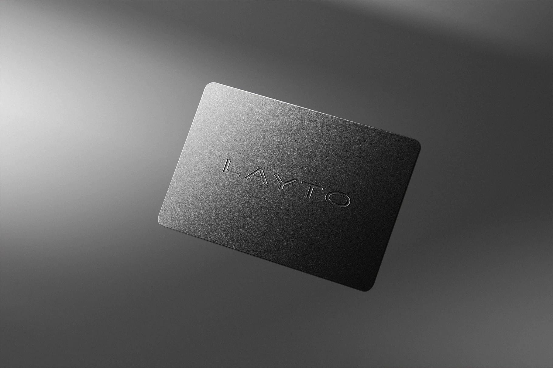 Luxury business card mockup with deboss effect on a dark background.