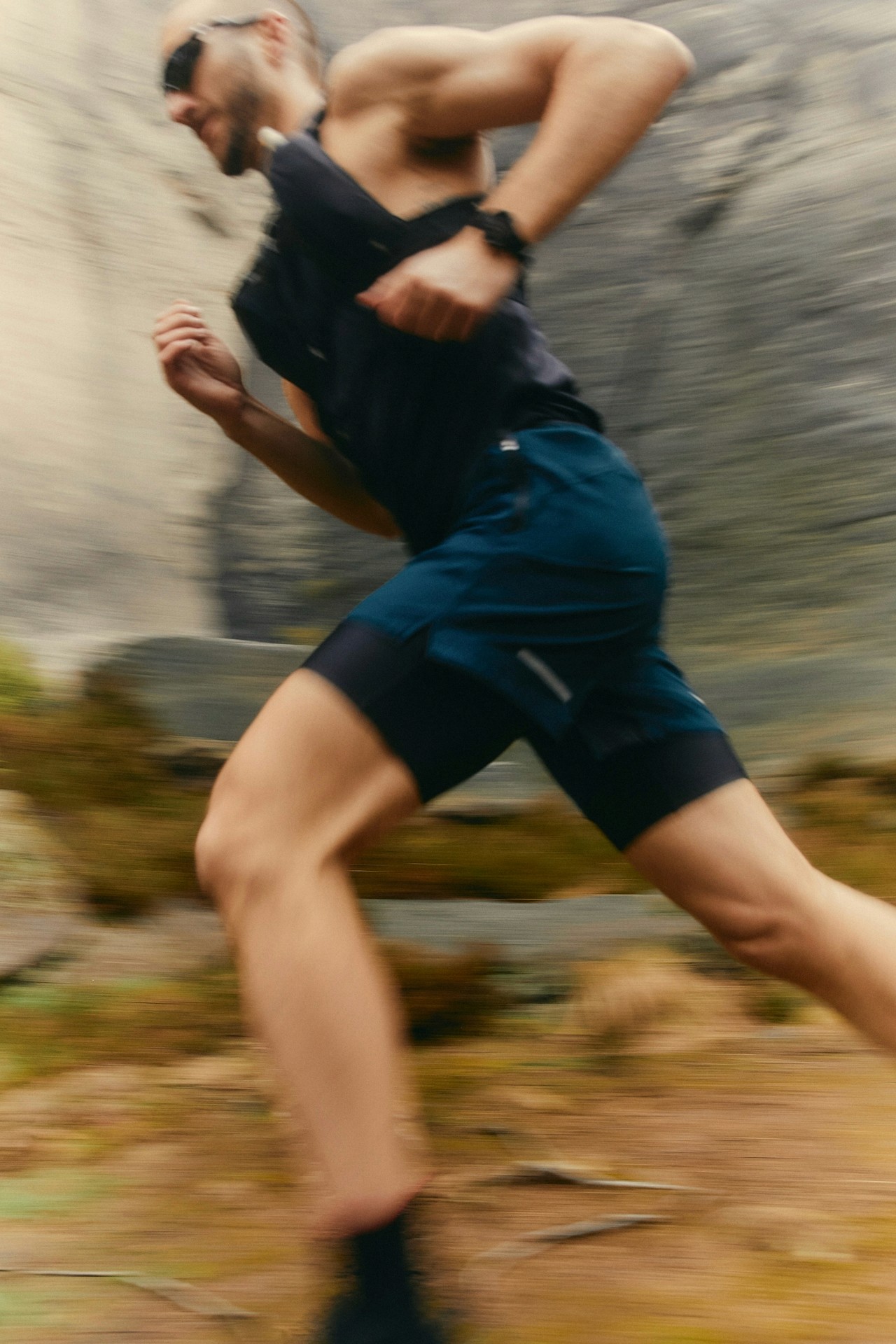 grayscale photo of woman with gloves touching heavy bags