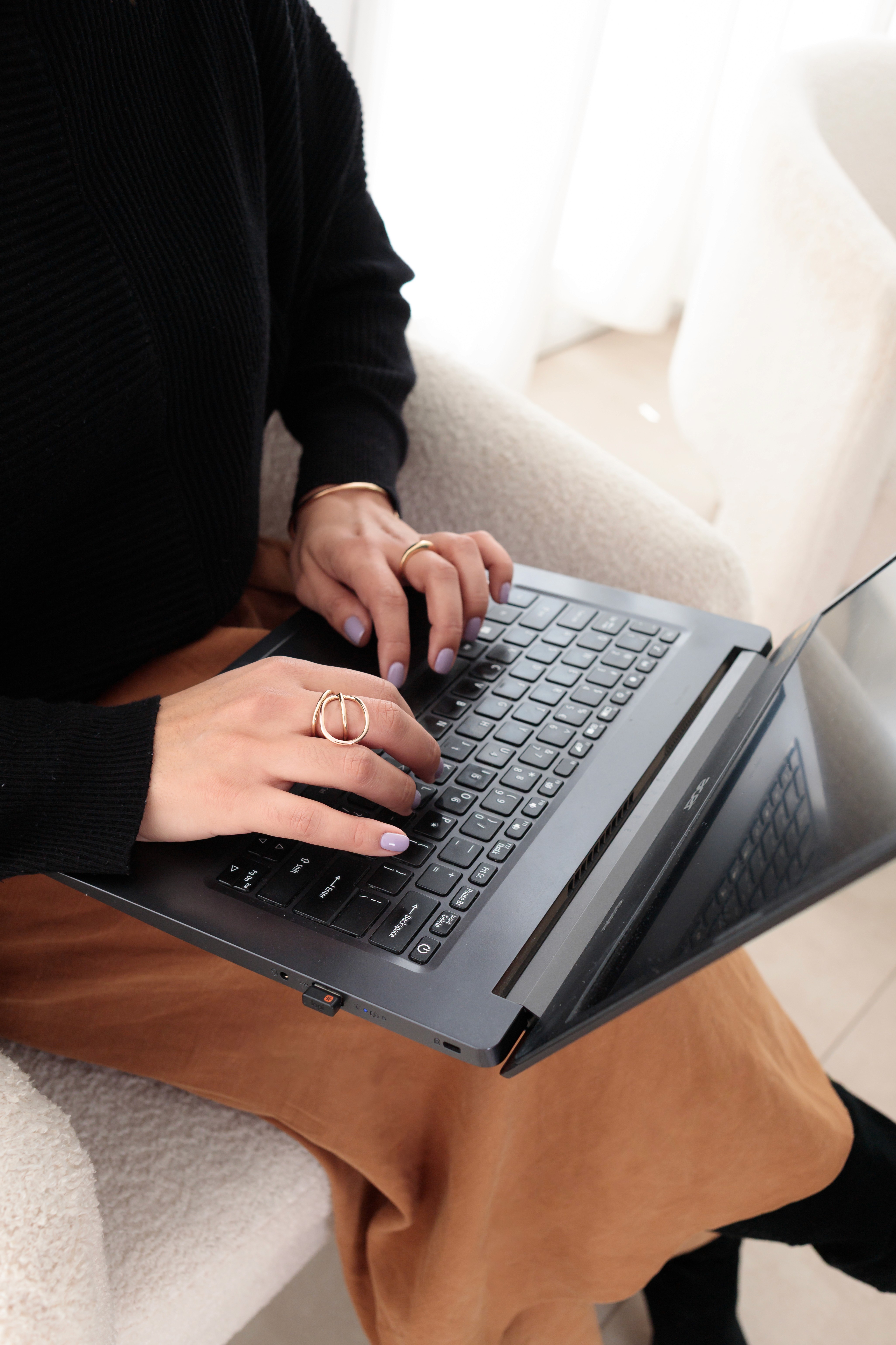 Patricia Ordoñez brand and web designer working on her laptop