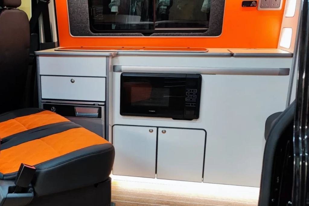 Microwave in a VW transporter camper van kitchen