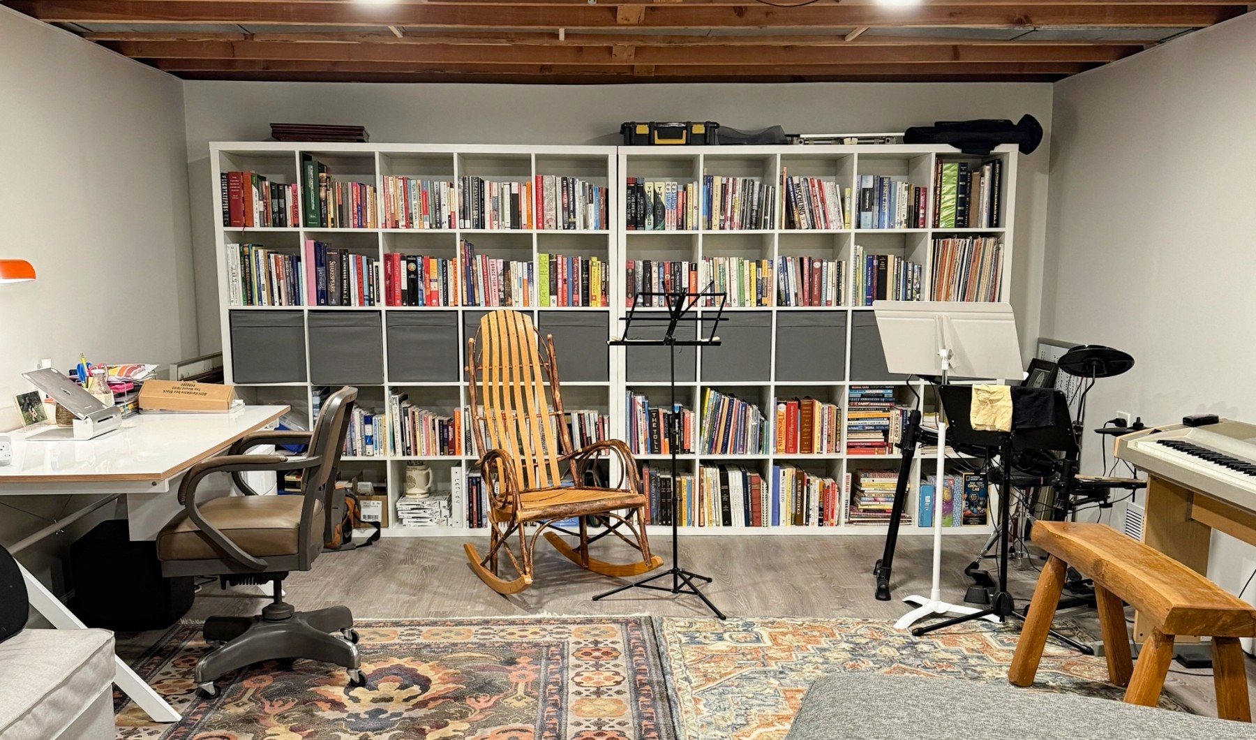 modern and organized stylish basement with books and music