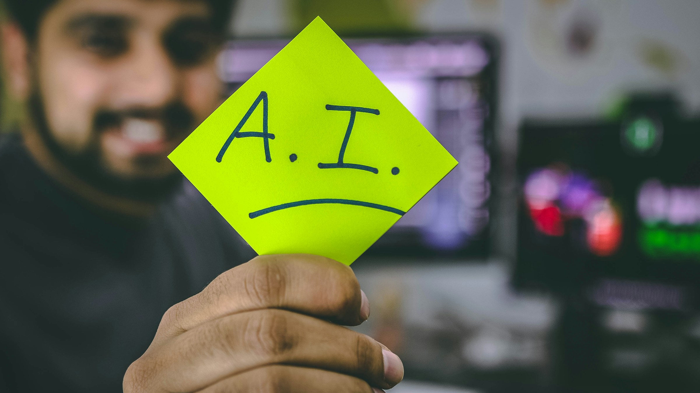 man holding AI sticker - Machine Learning Data Cleaning