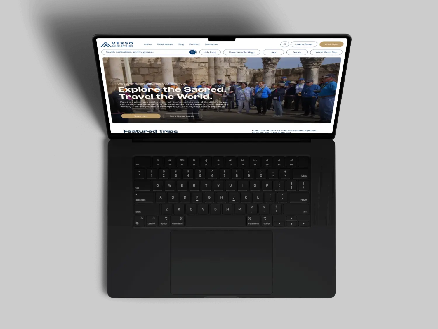 A panoramic view of a city skyline featuring buildings under a clear blue sky.