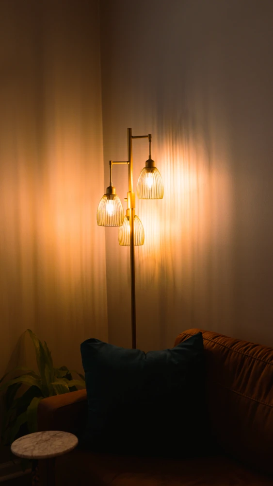 Softly lit room with warm pendant lights creating a calm, reflective atmosphere.