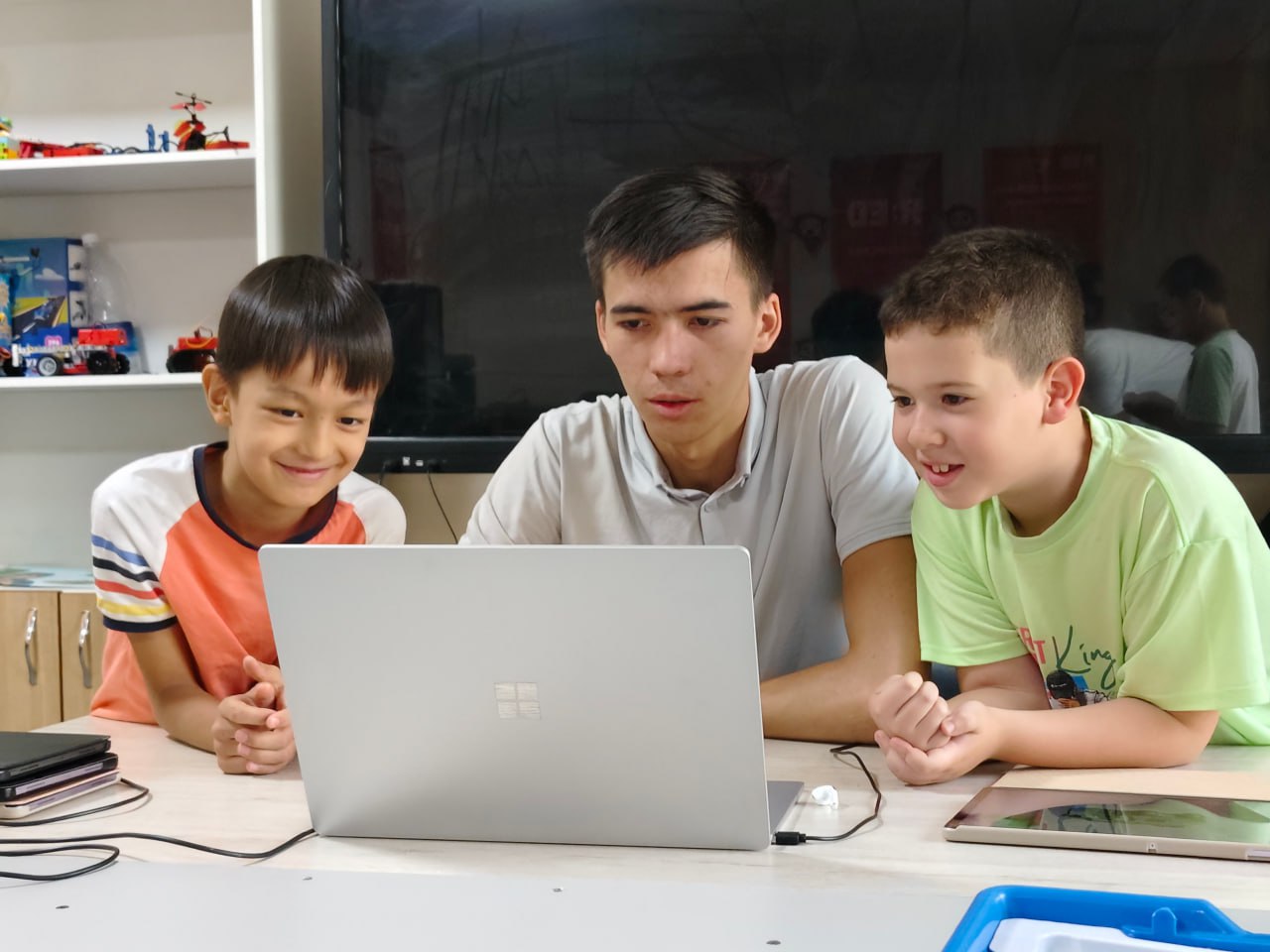 A man stading with Surfboard