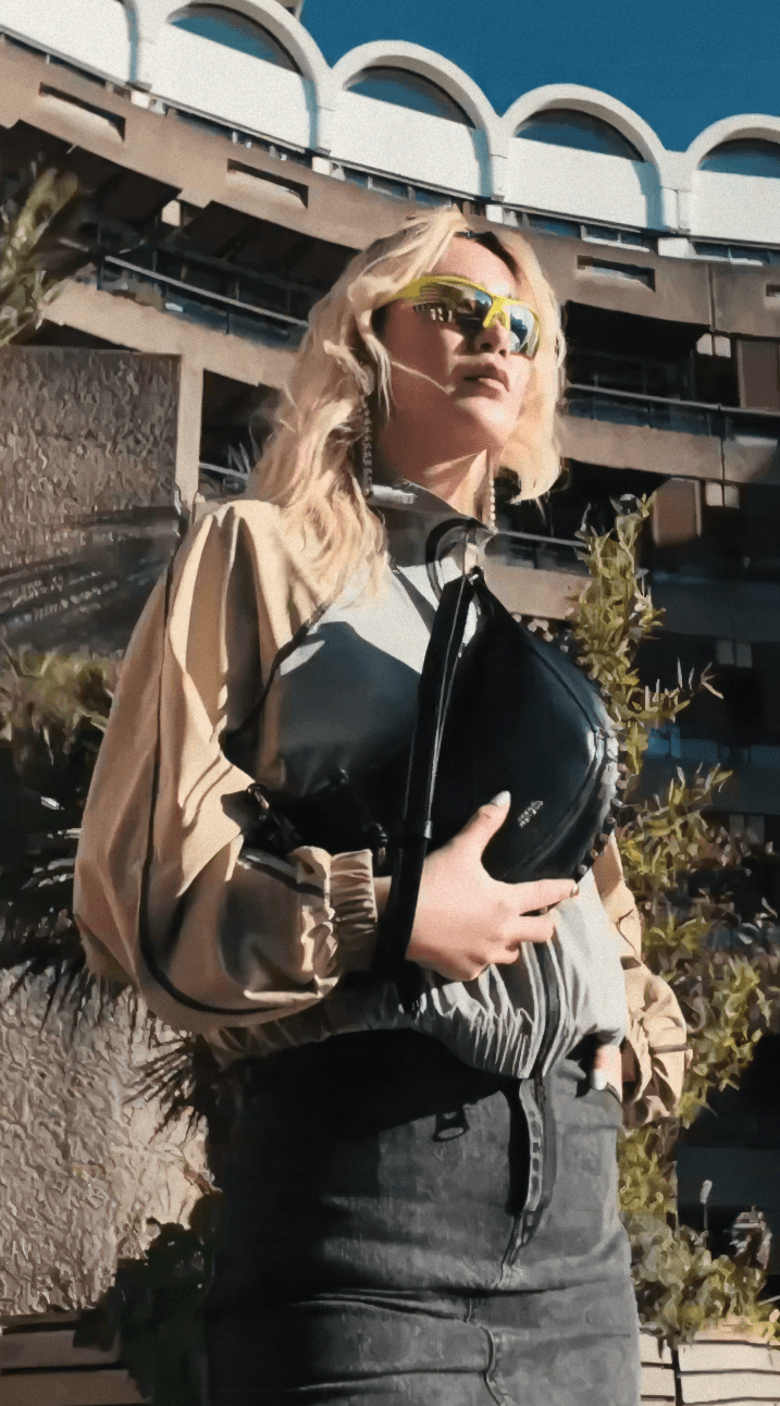 Woman hugging Shiba Inu dog, both looking at camera