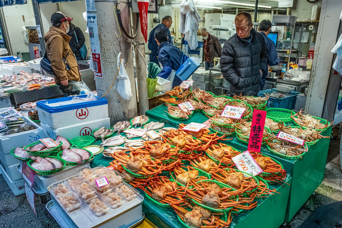 Fresh seafood displayed at an outdoor market stall in Japan