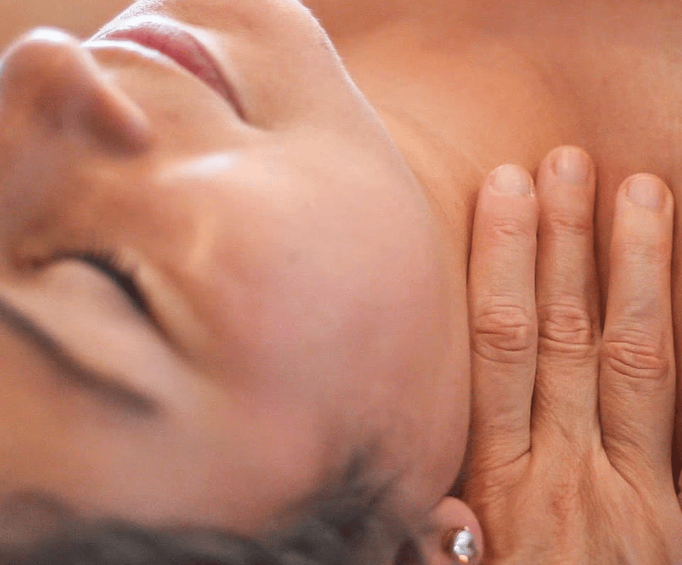 Lymphatic Glow treatment with gentle hands-on work around the neck