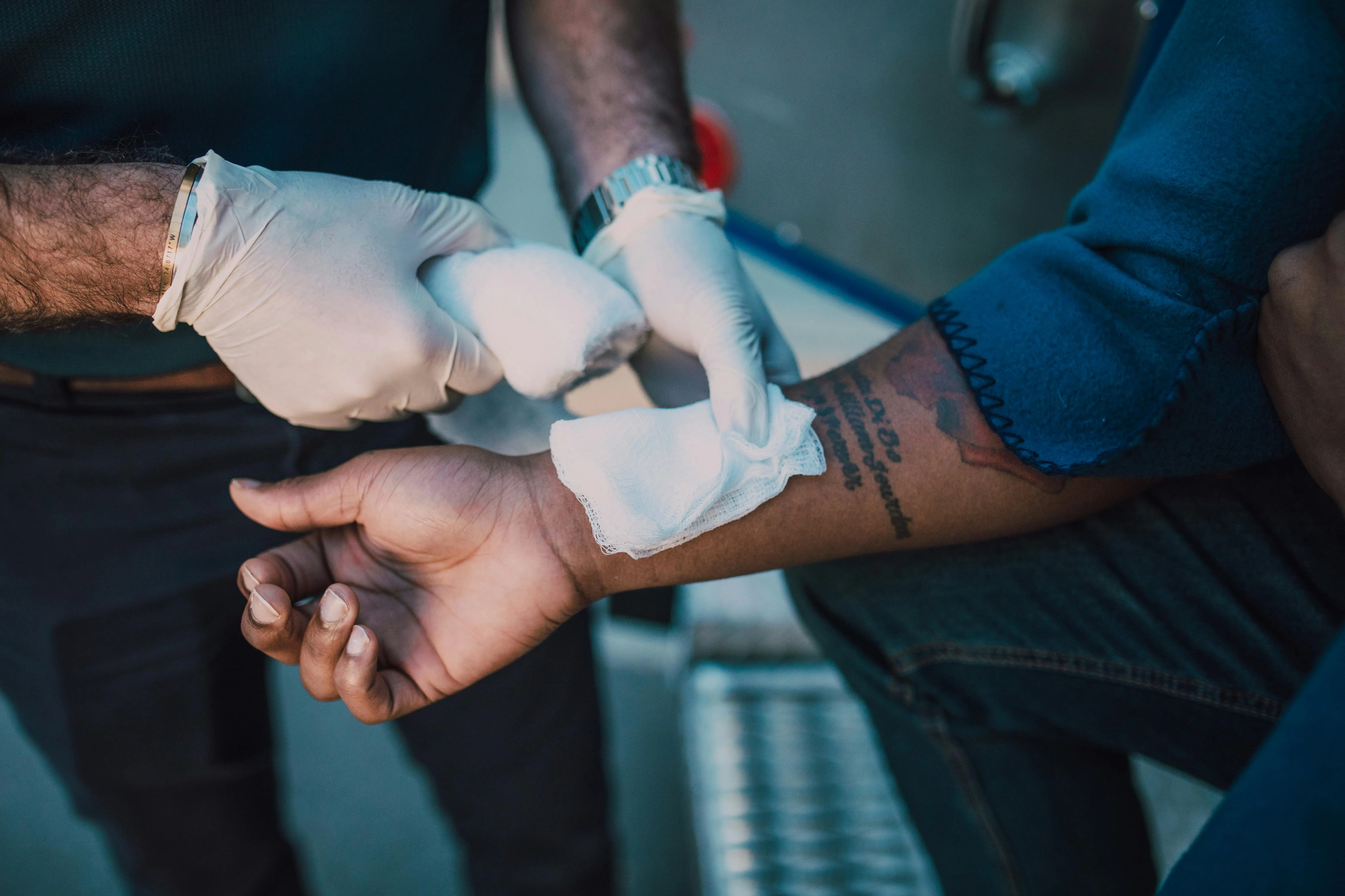 Person With White Bandage on Left Hand