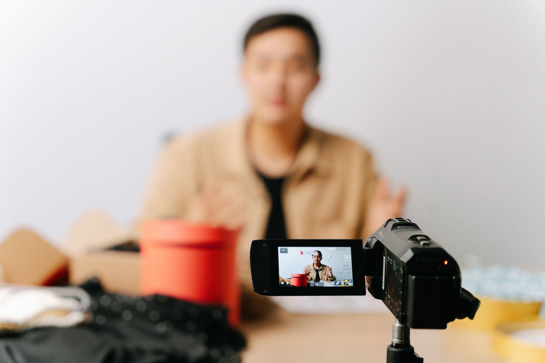 Creator recording a product video with a camera
