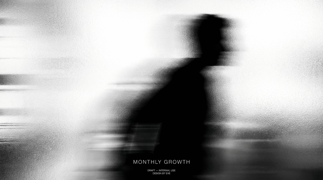 Futuristic black and white robot facing forward on minimal backdrop.