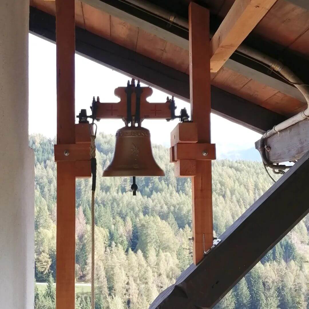 Traditional bell under the roof of the house