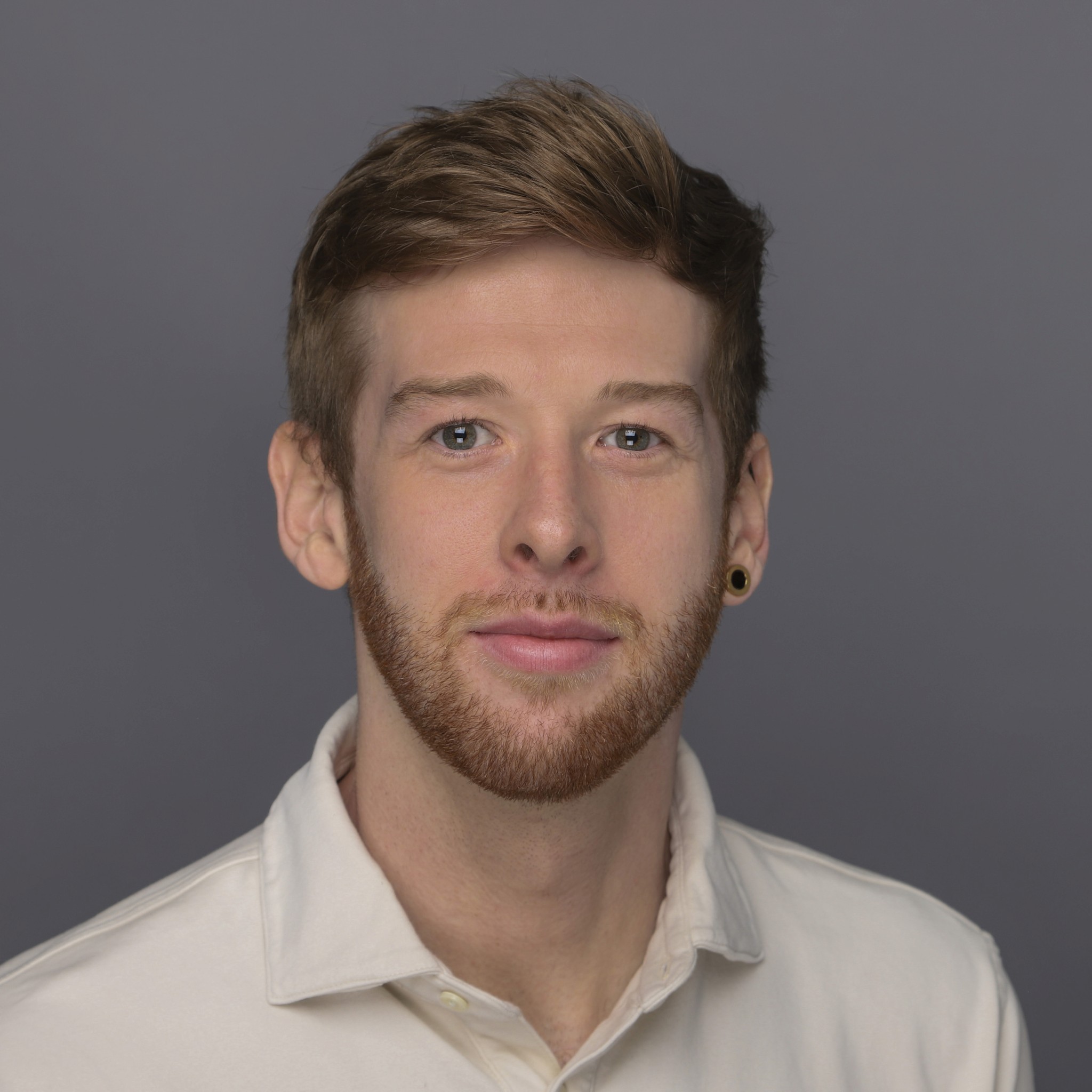 A portrait of a young man smiling