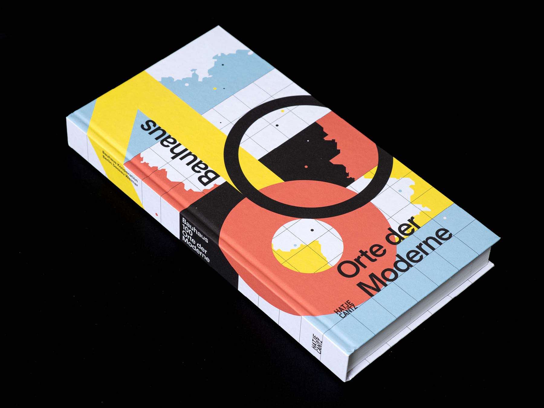 Bauhaus 100 Orte der Moderne hardcover book by Hatje Cantz lying flat, showing its geometric Bauhaus-style cover design.