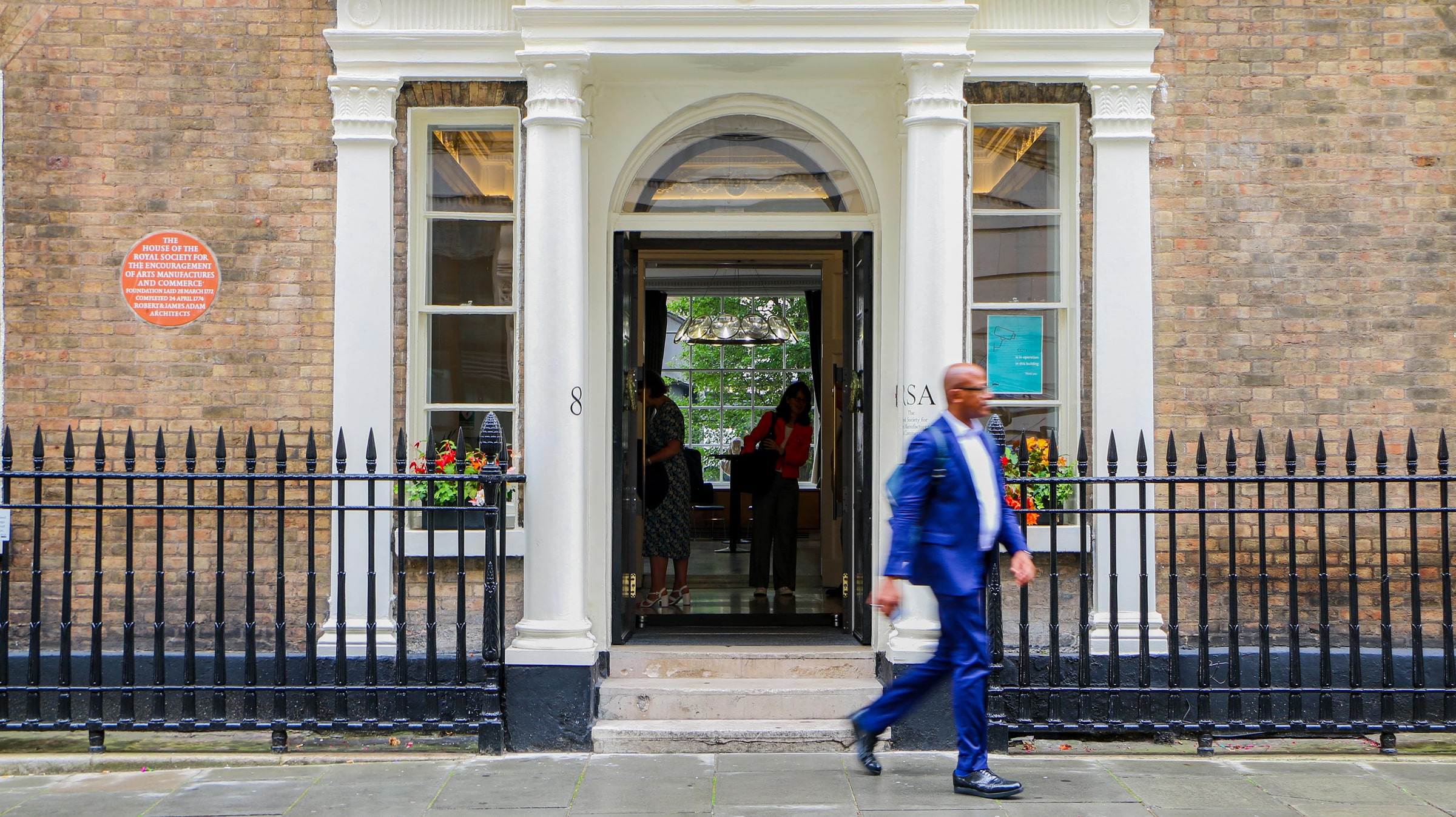 A man leaves the Royal Society of Arts in London after an NHS roundtable event