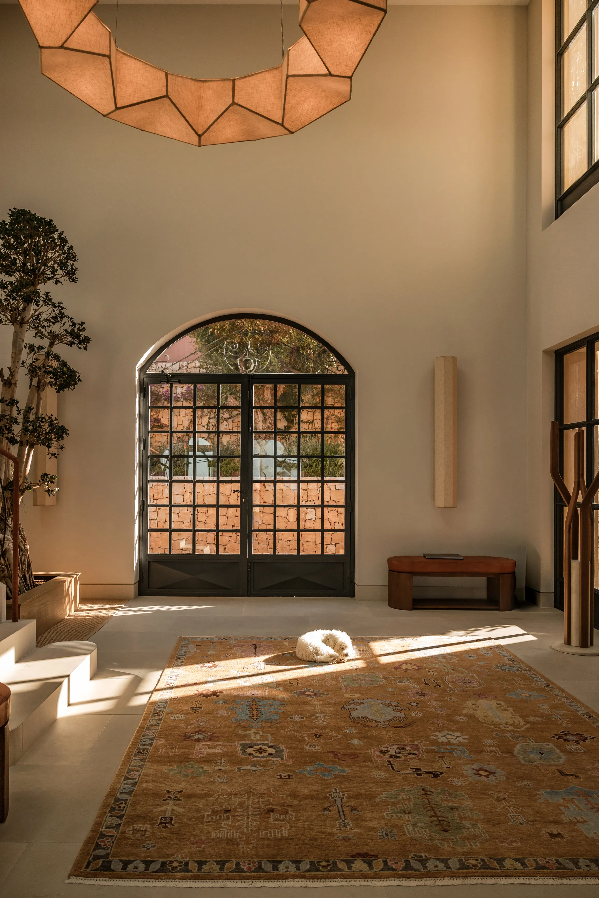 Luxury residential entrance with bespoke lighting and contemporary architectural detailing.