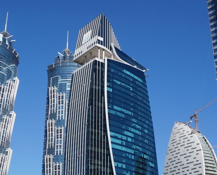 Al Manara Tower waterfront office location with scenic canal views.