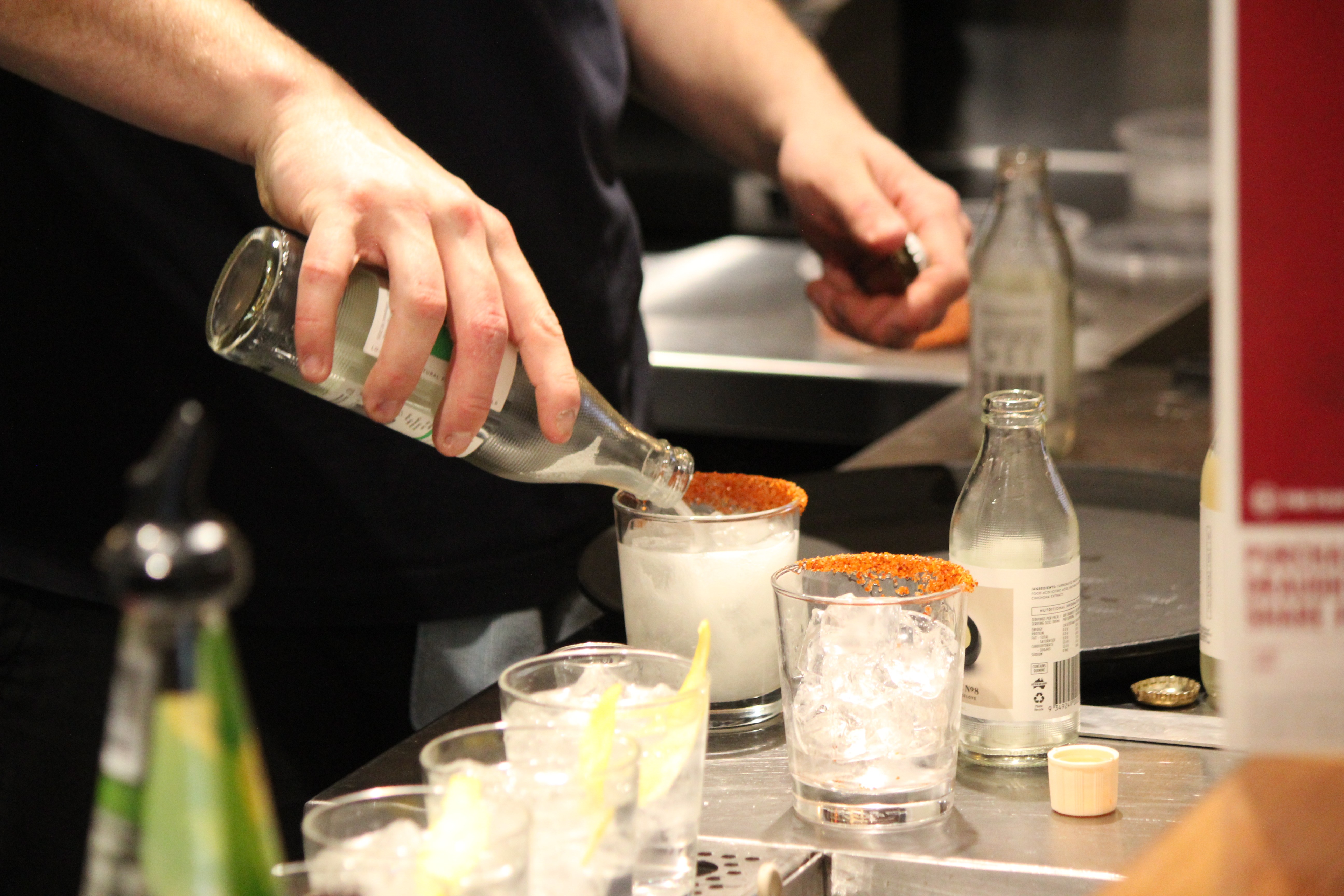 Photo of a bartender from The Park Hotel Ballarat pouring drink into glass shot by RHMedia