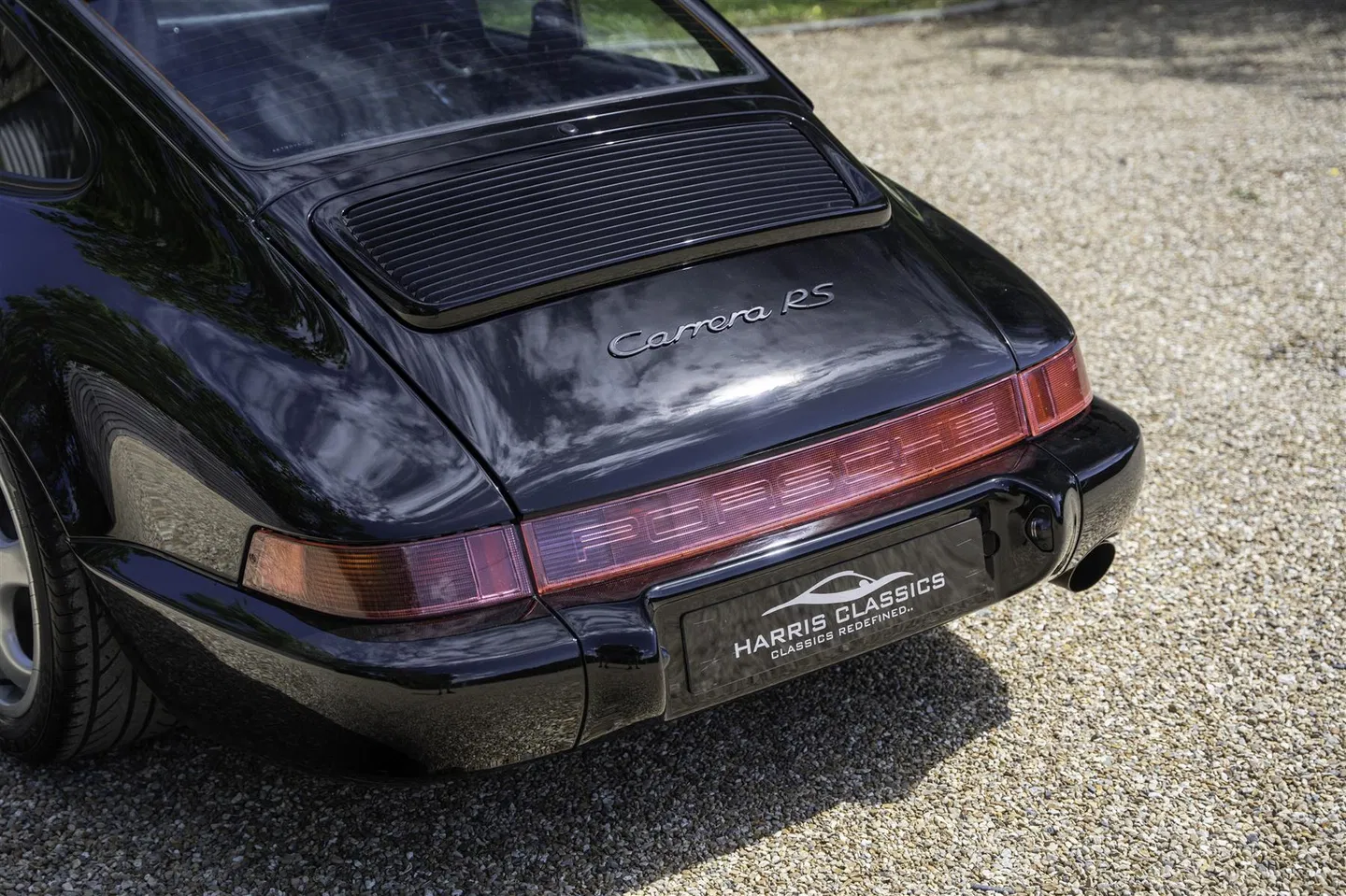 Rear engine lid with Carrera RS script badge and Porsche light bar