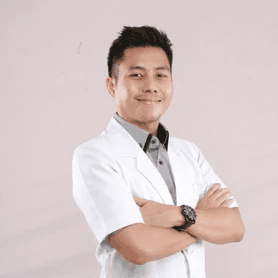 a man in a white shirt and tie posing for a picture