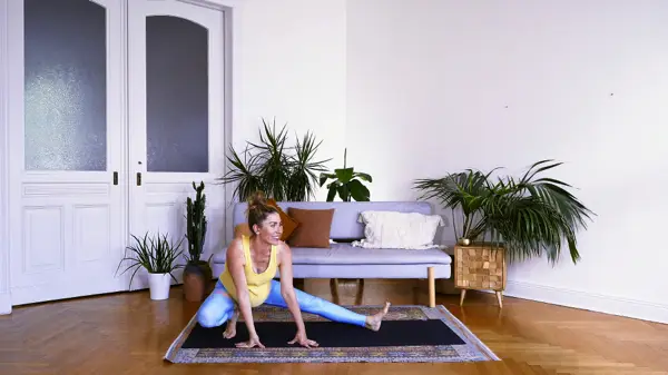 Pregnant woman in a gentle standing yoga pose with props – Day 1 full spectrum prenatal yoga flow with breathwork to connect with your changing body