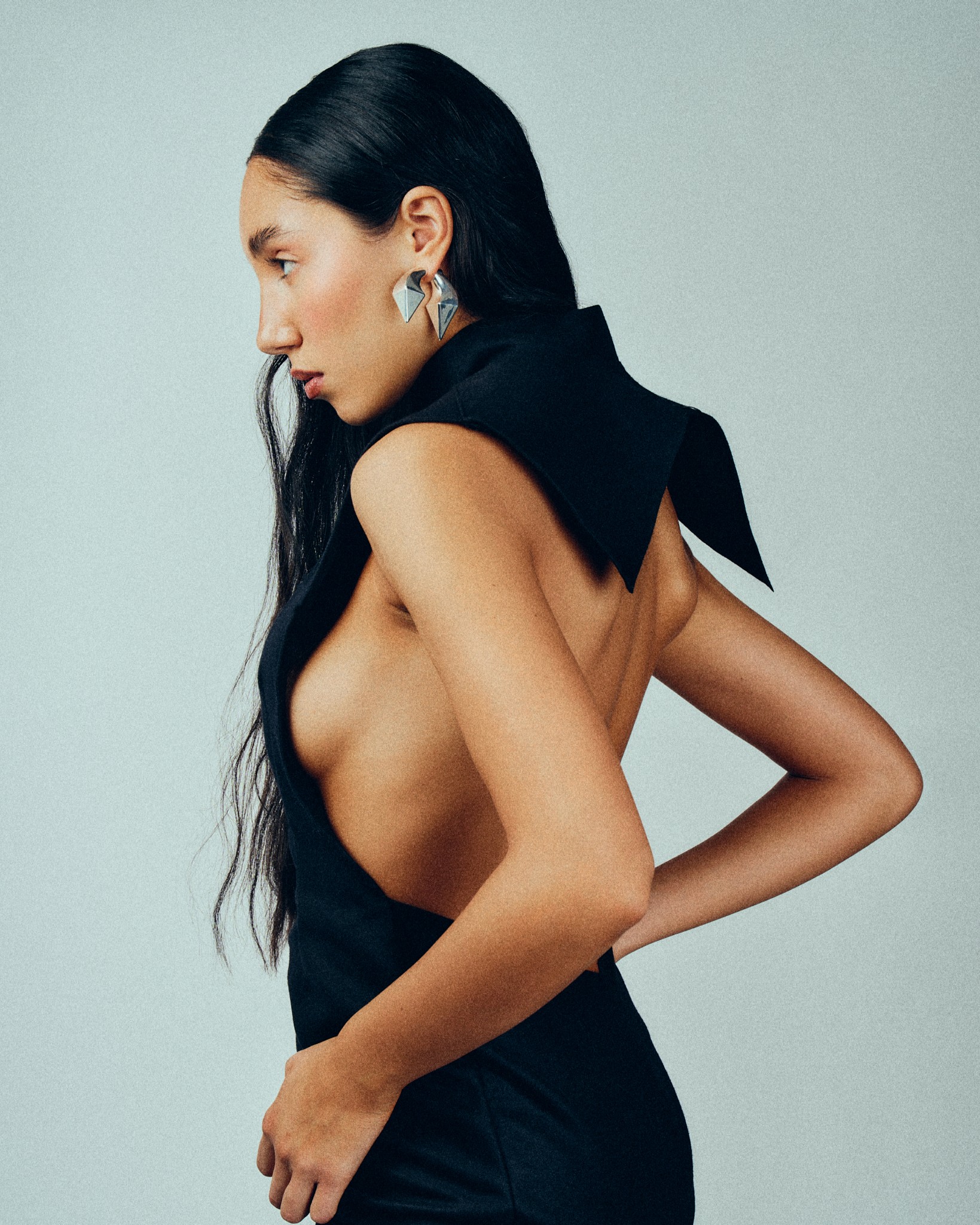 Girl leaning over a railing