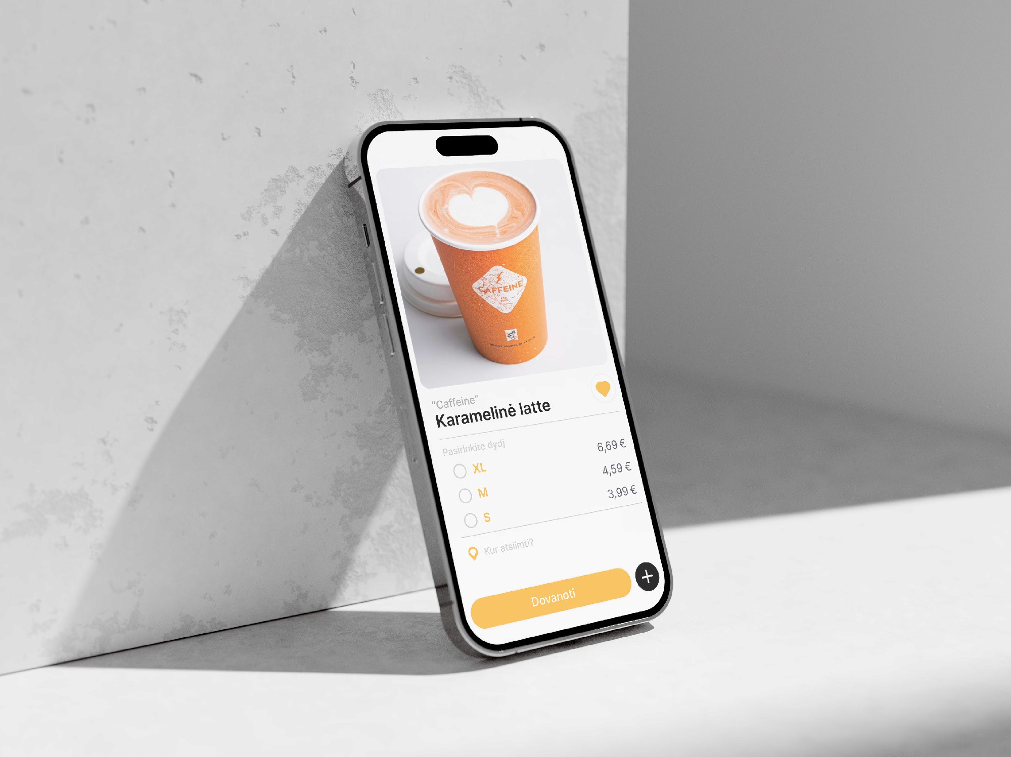 Hand holding a phone with the Judu app open, cyclists riding on an orange-marked bike lane in the background