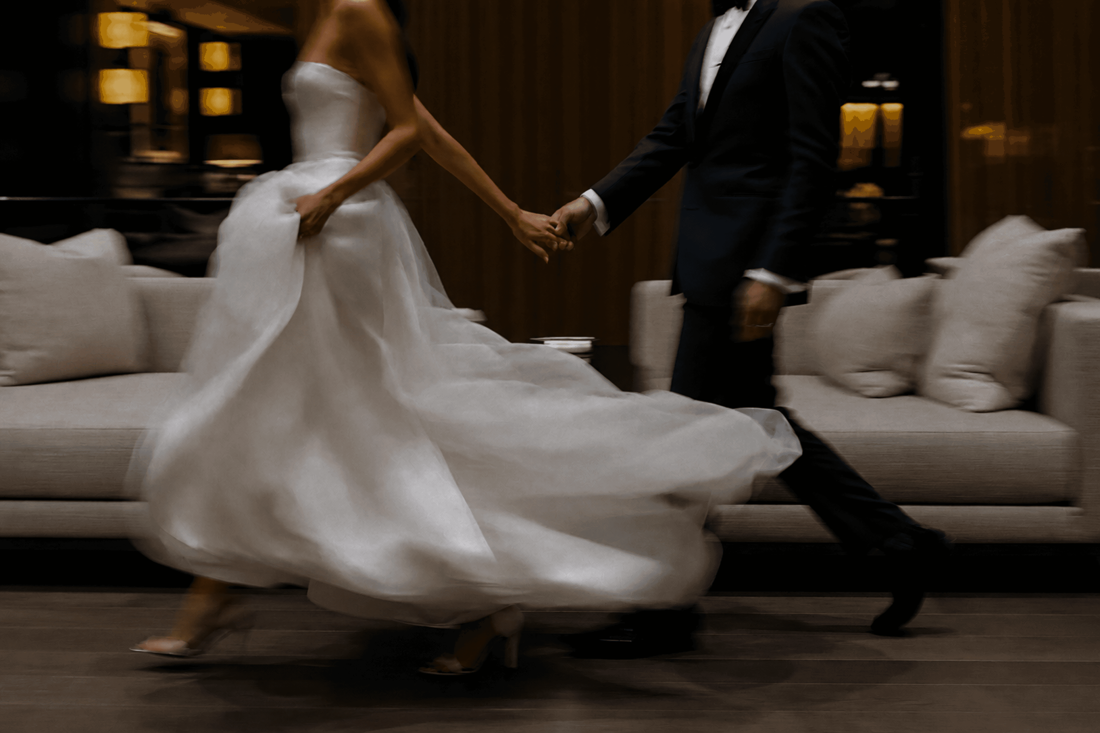 Wedding couple walking in an elegant reception hall