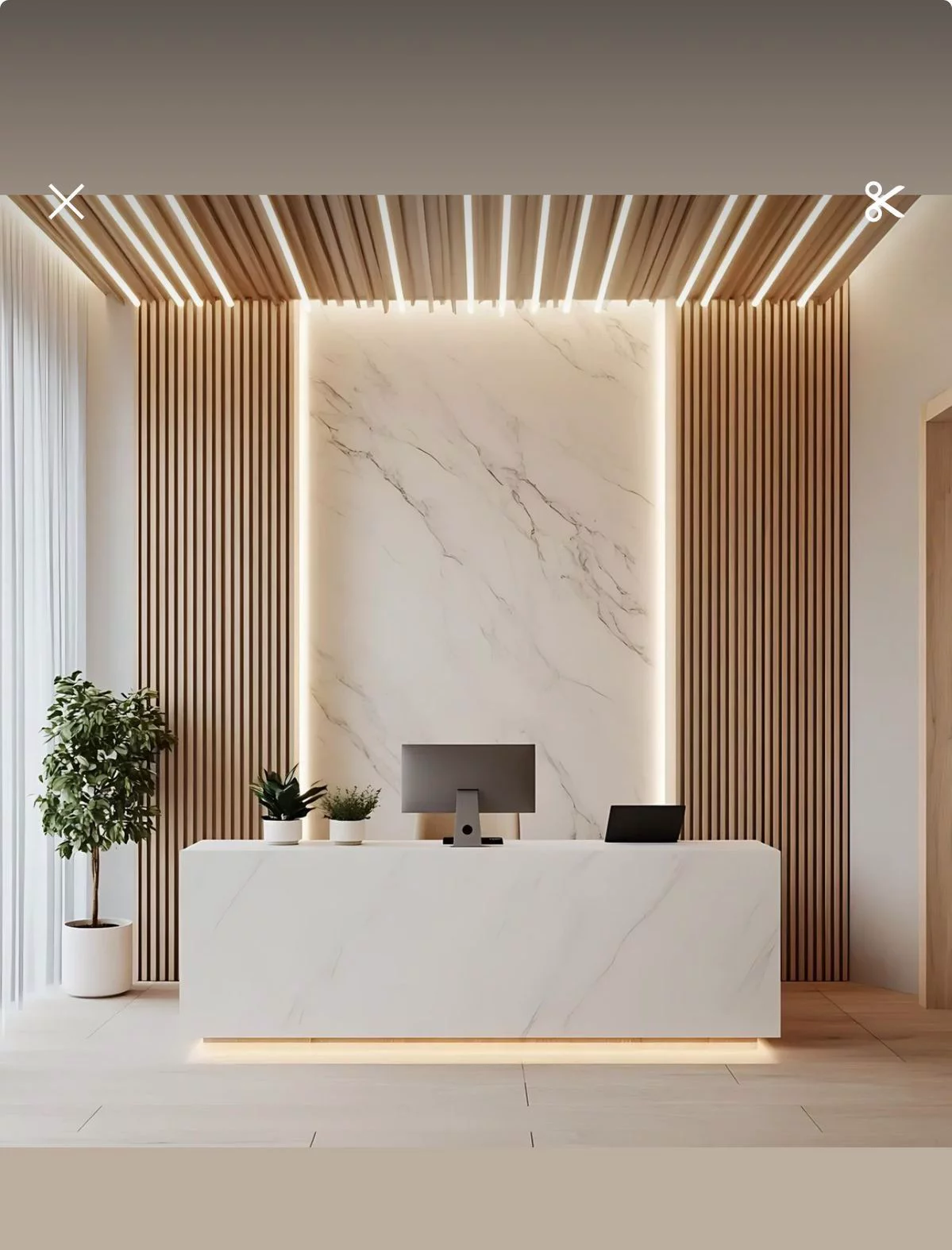 Modern marble reception desk inside a luxury medical spa.