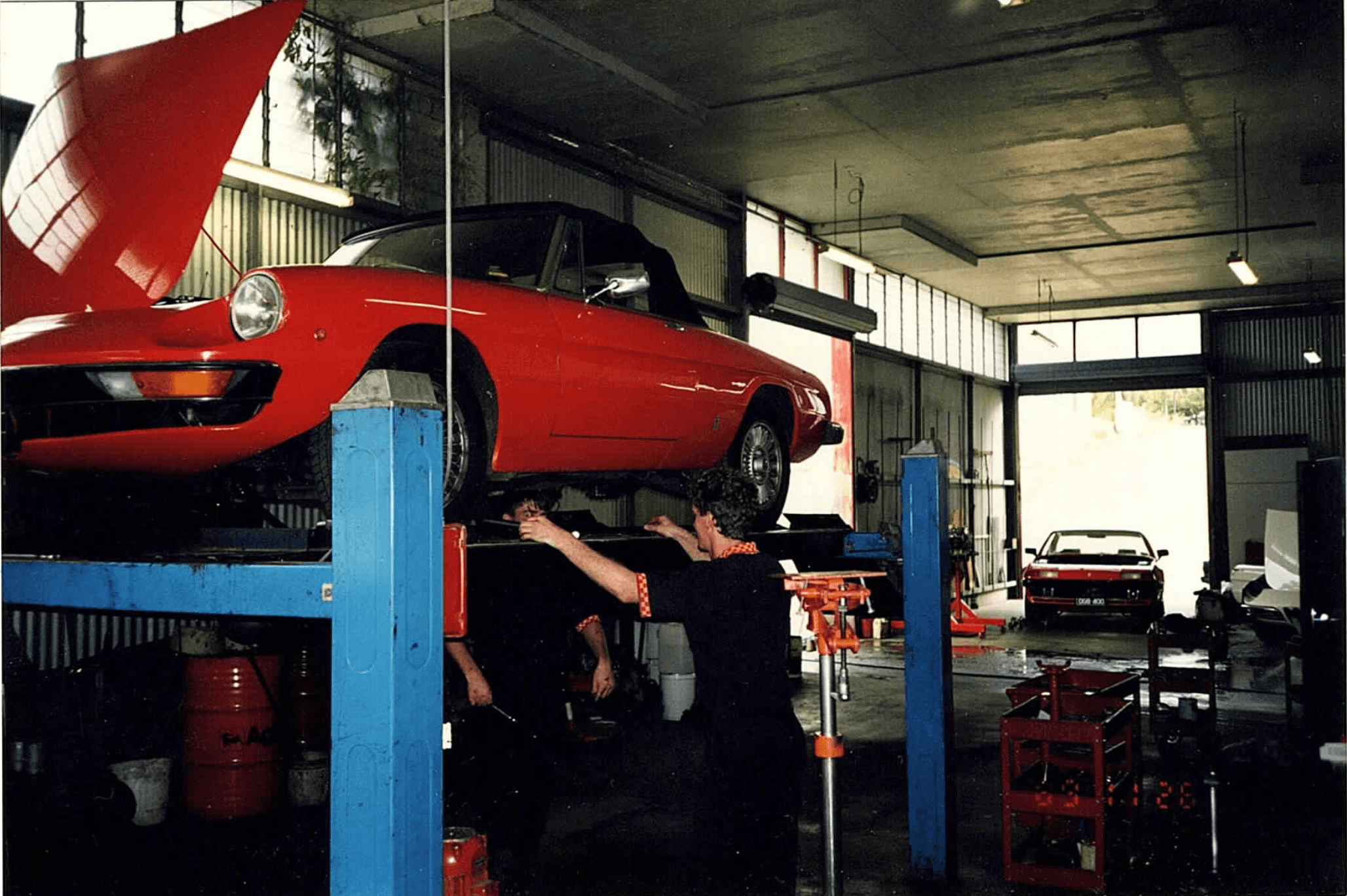 Artistic portrait with red and blue lighting creating a dramatic effect