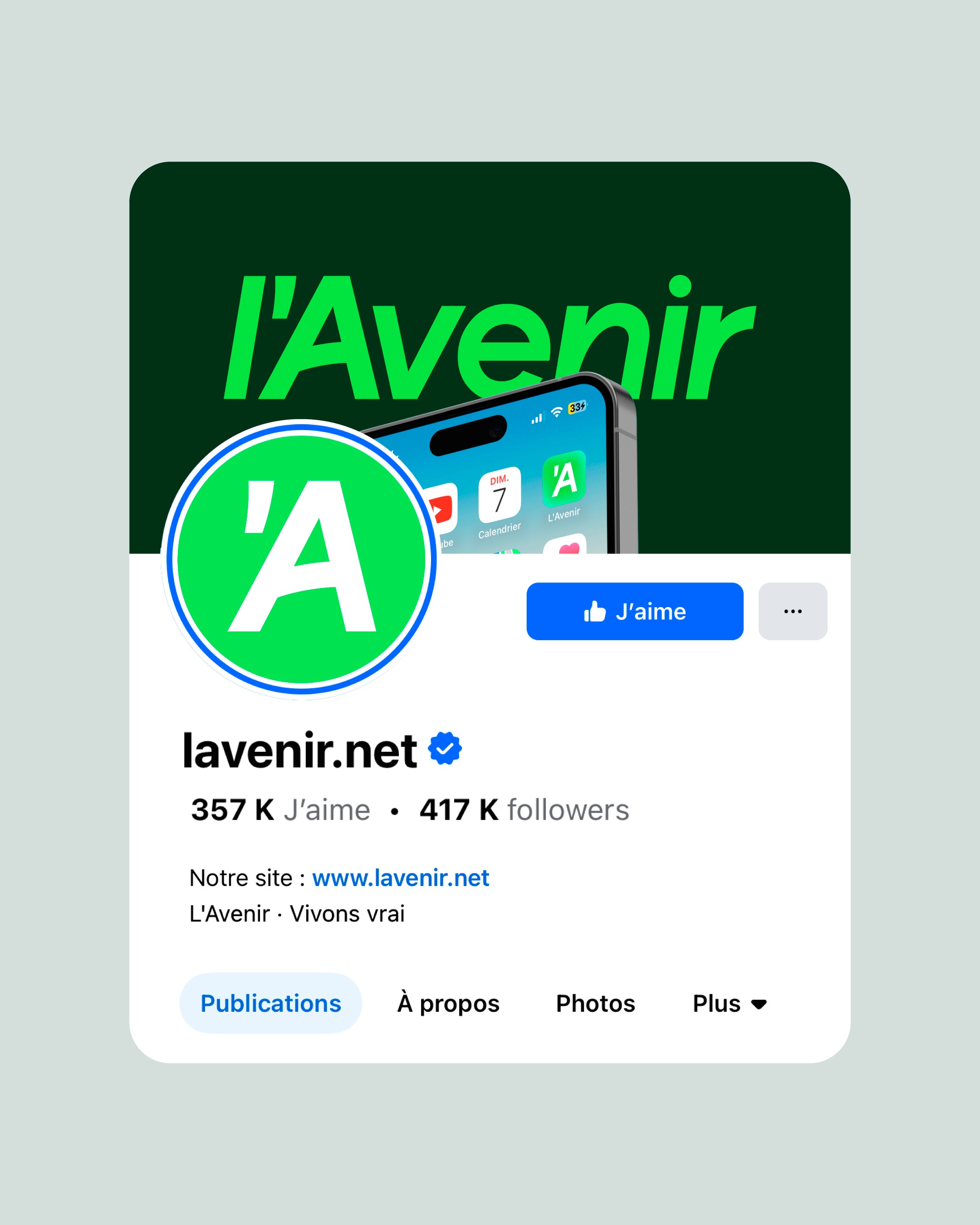 Modern home office setup with a monitor, ergonomic chair, keyboard, and indoor plants near a window with blinds.