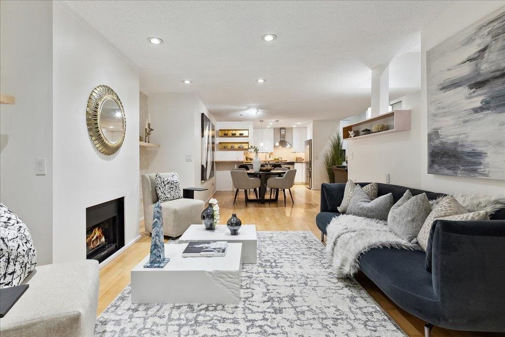 Cozy living room featuring a neutral color palette, modern decor, and a comfortable seating area with a rug.