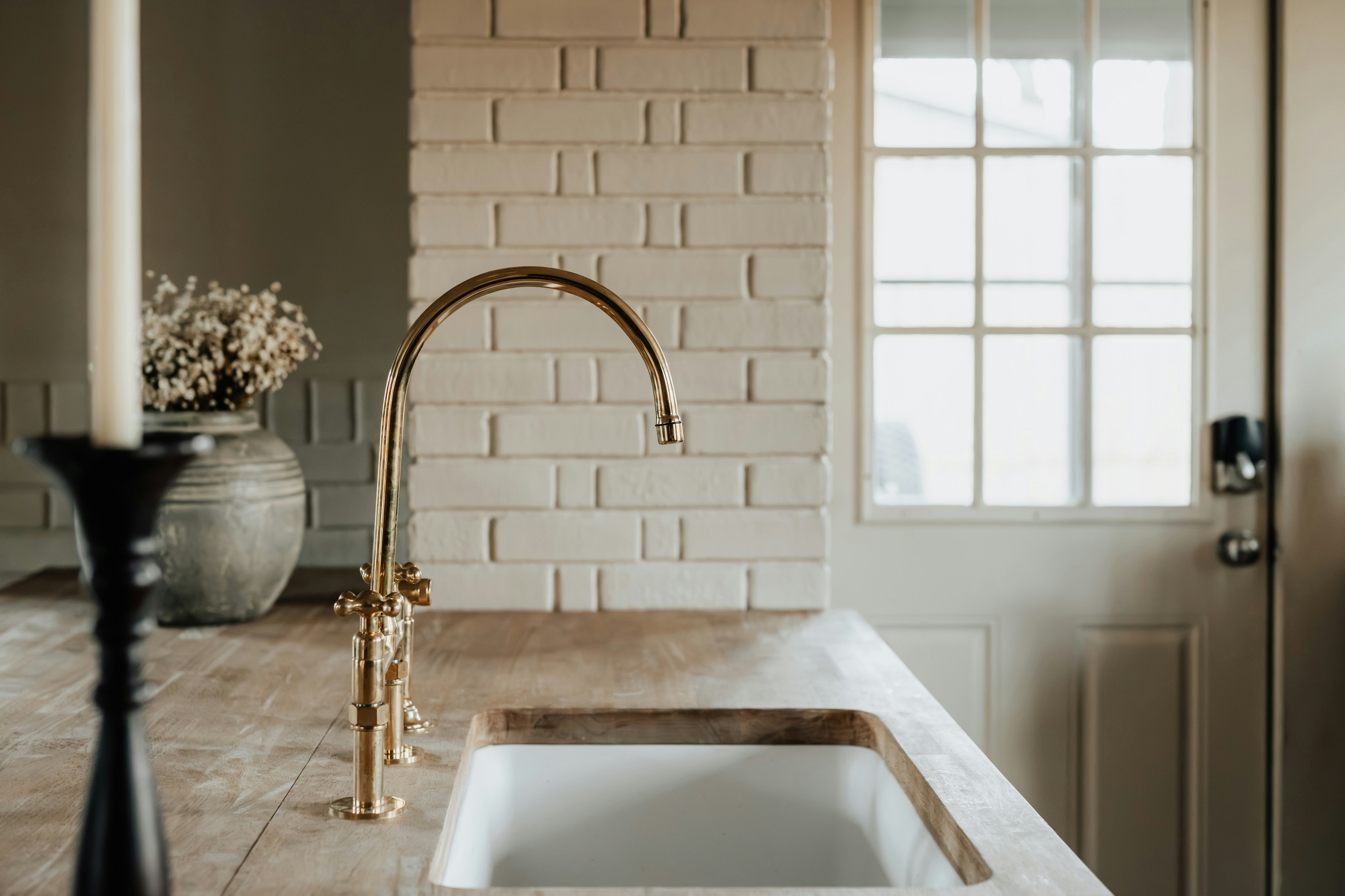 a woman wearing a black coat and a white scarf
