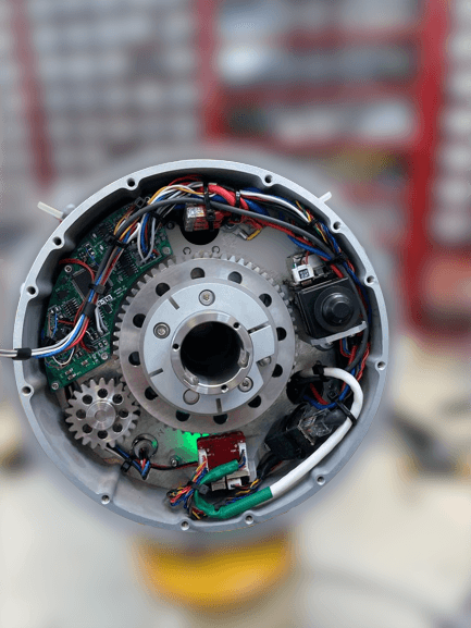 Opened JettyRobot hub showing gear train, control boards and the compact Ethernet switch