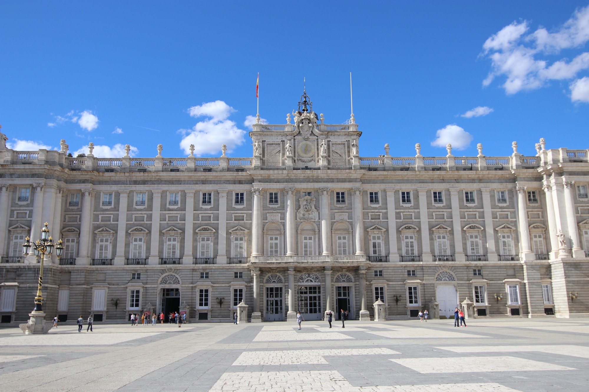 an aerial view of a baseball stadium with a city in the background