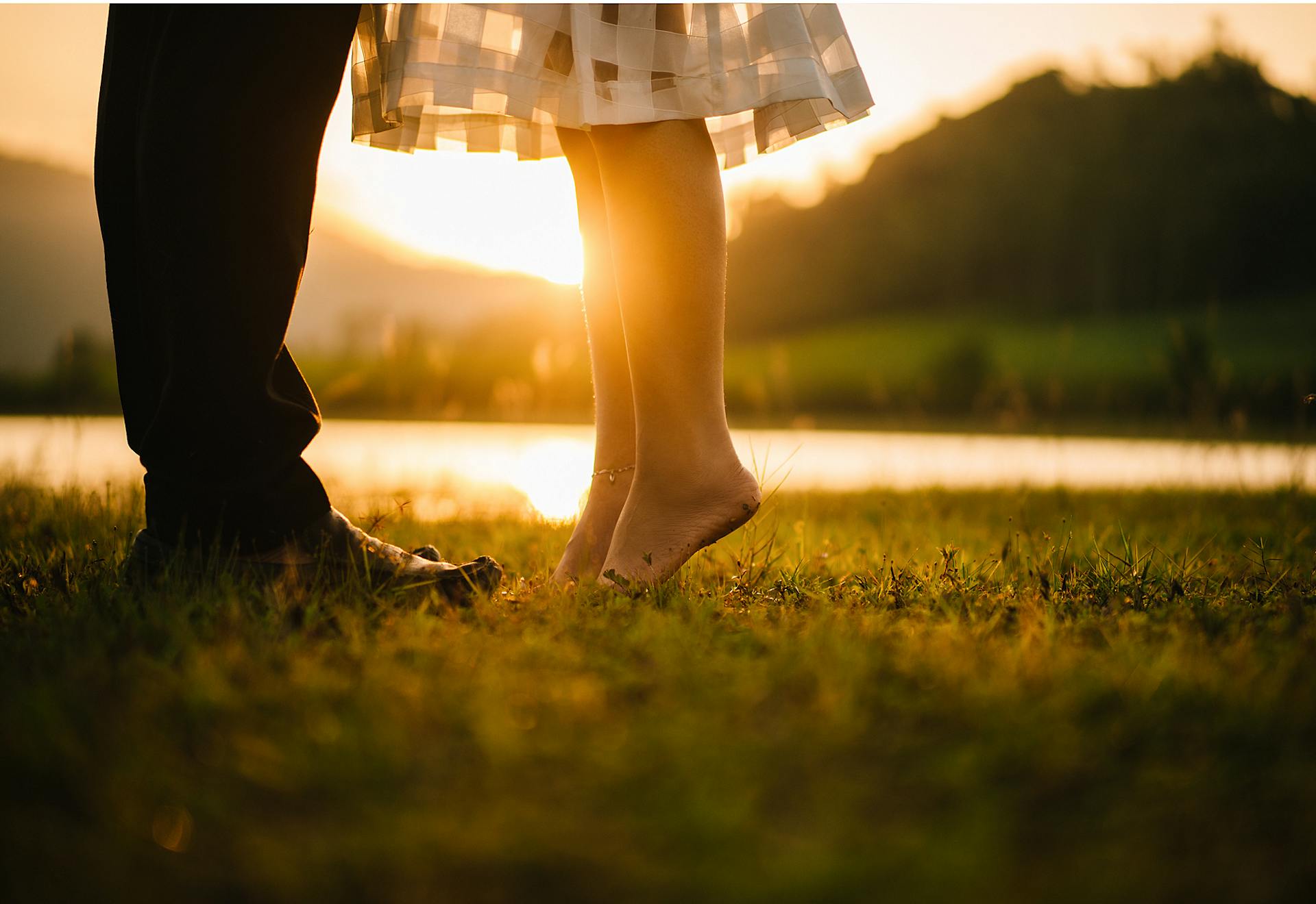 Feet of couple in field