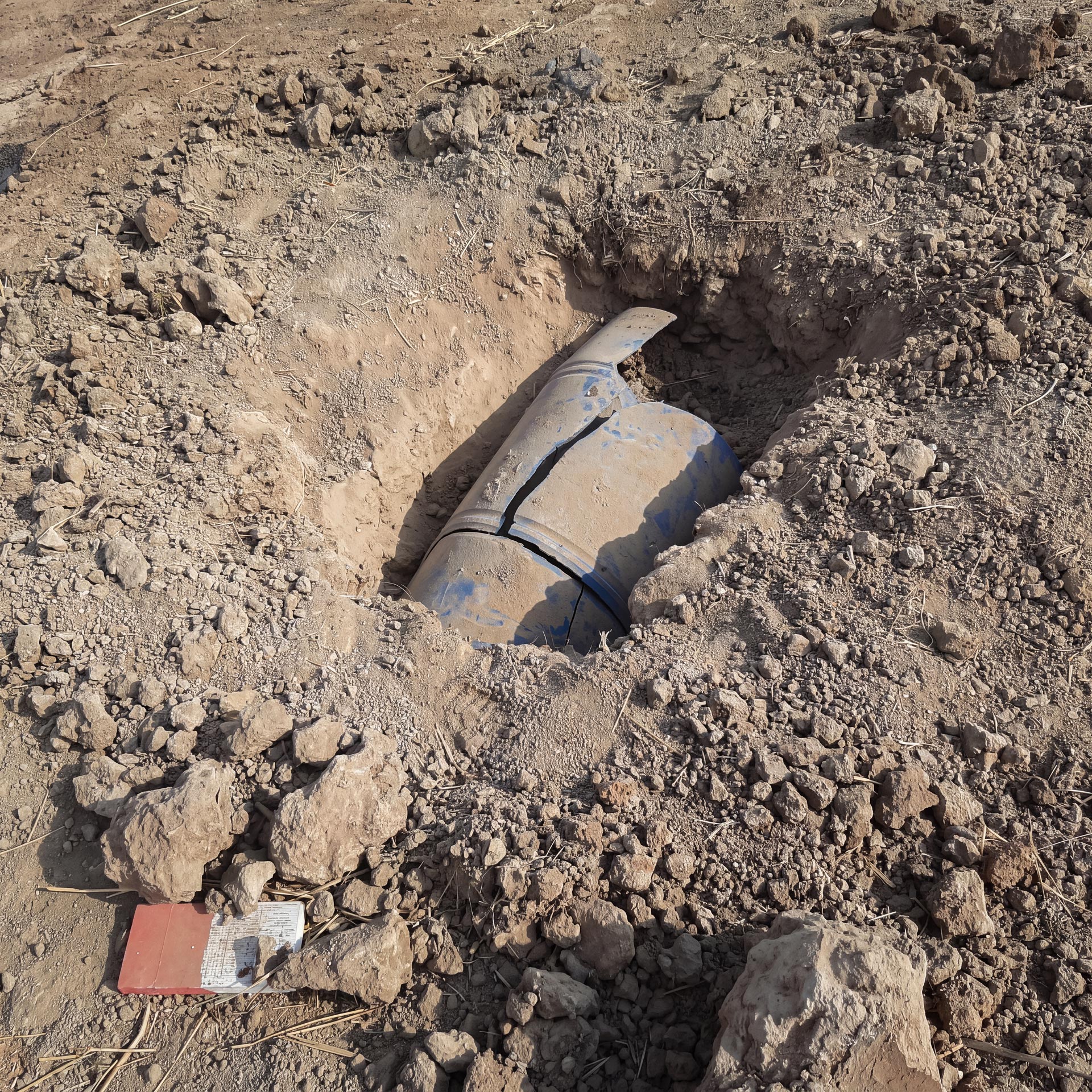 Buried improvised explosive device uncovered during GCS IEDD search operations.