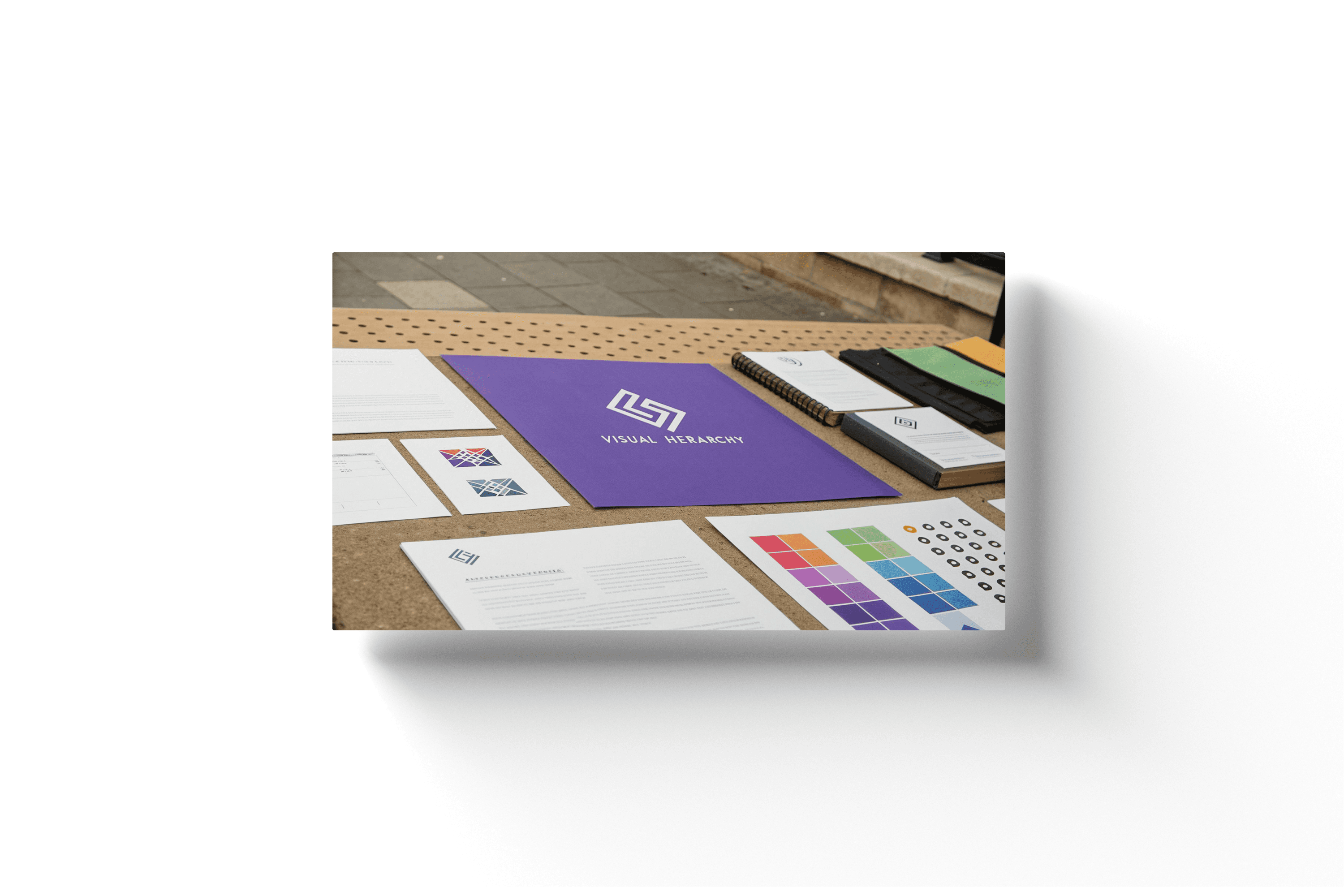 a purple piece of paper on a desk that reads 'visual hierarchy'