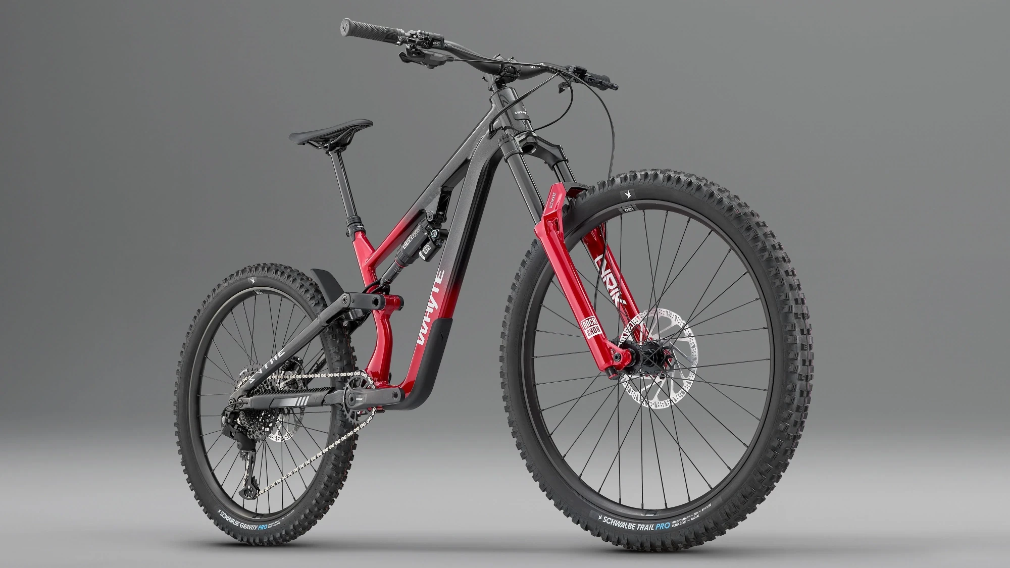 Three-quarter studio angle of Whyte Sythe trail mountain bike highlighting suspension linkage, aggressive geometry, and integrated frame design.