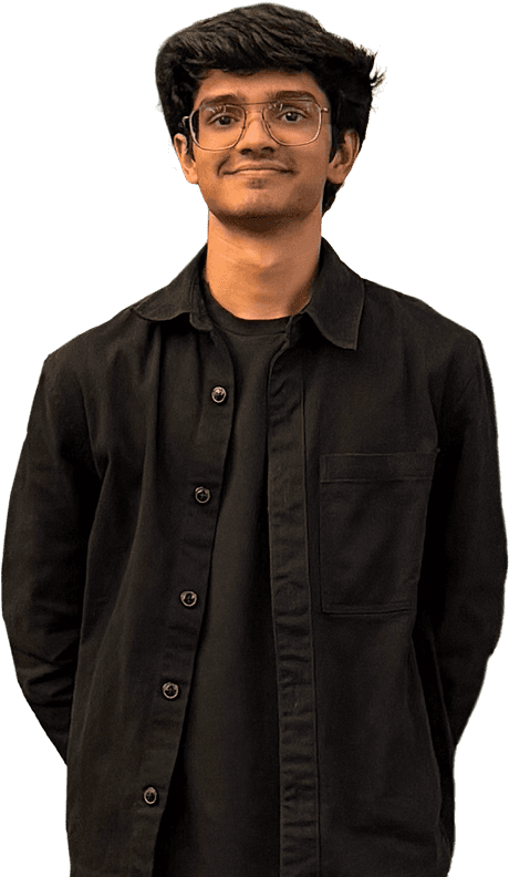 Professional woman in a suit standing in an office setting.