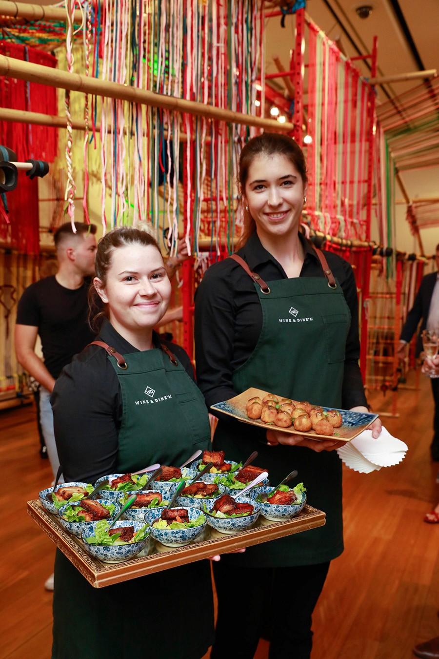Front of house service staff tray serving bite-sized and substantial canapes