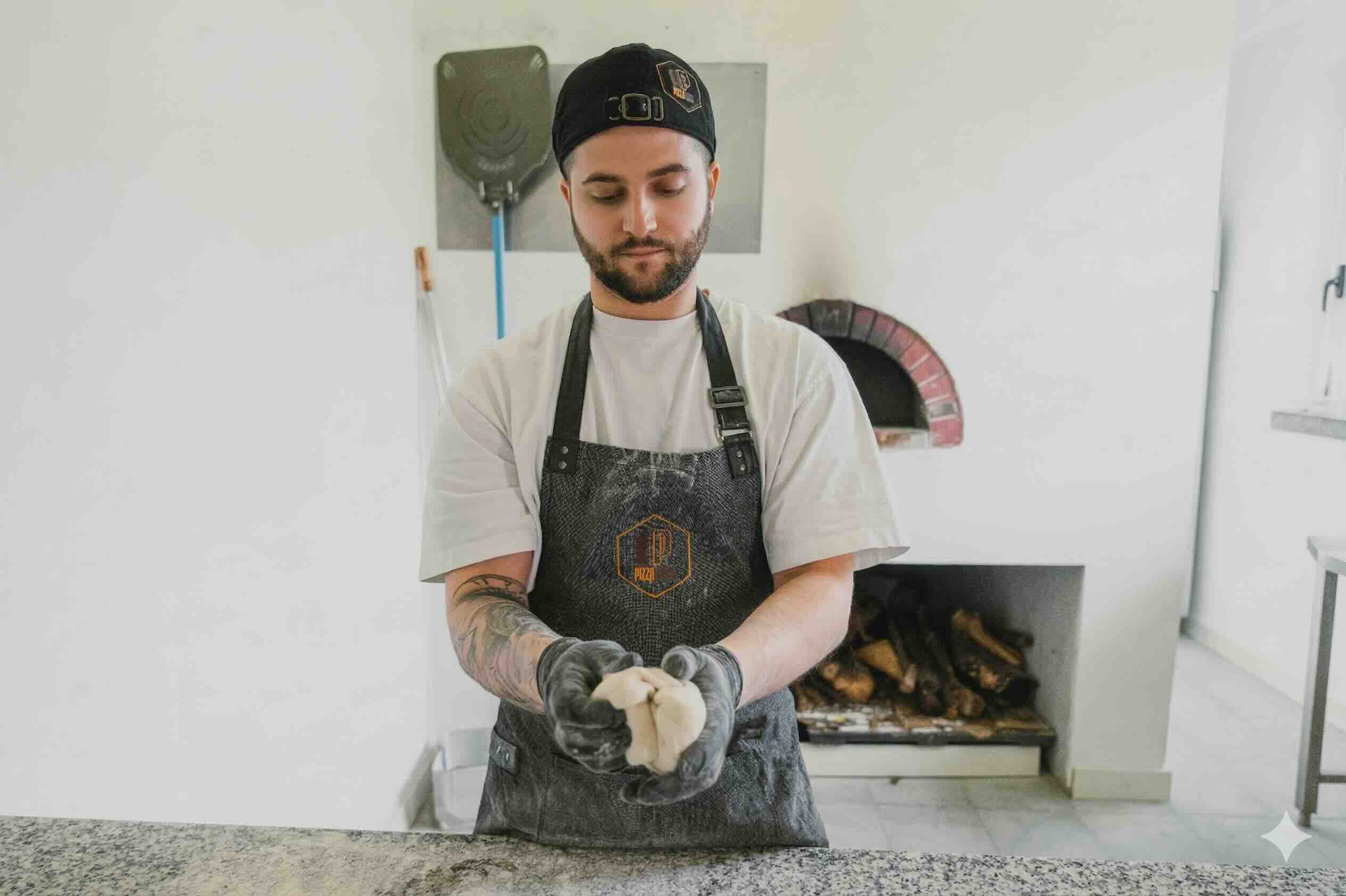 Milk being poured into black coffee in white cup